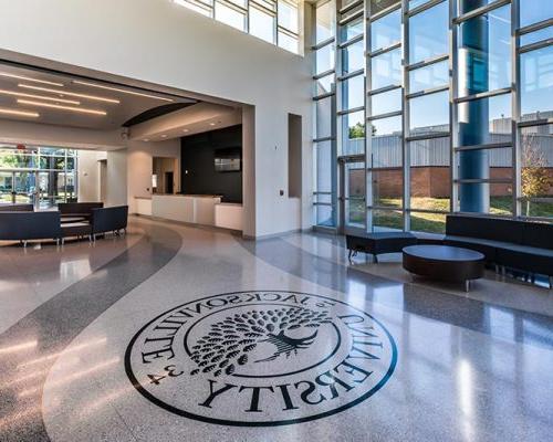 Frisch Welcome Center lobby featuring Jacksonville University logo inset in terrazzo floor